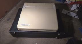 The laptop in a closed position. Note the attention to detail in the shaping of the case.